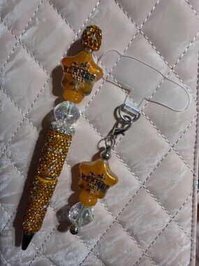 Orange and silver rhinestone pen and matching phone charm.
